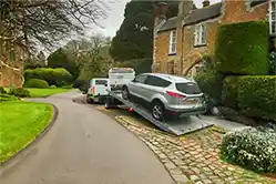 Car on a Tilt and Slide Recovery Truck.